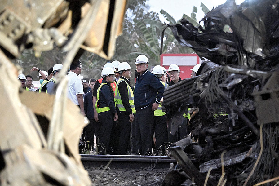 Crane falls onto Thai train,  kills at least 30 people